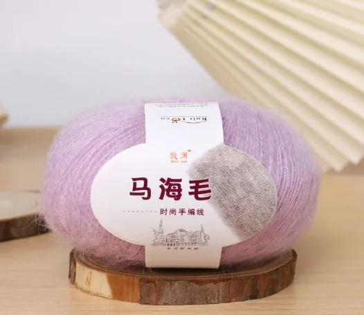 DIY mohair scarf knitting kit showing a ball of wool with 34 colour options including white, grey, pink, and blue.