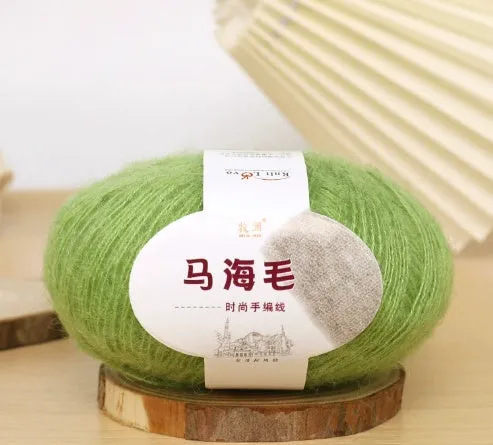 DIY mohair scarf knitting kit showing a ball of wool with 34 colour options including white, grey, pink, and blue.
