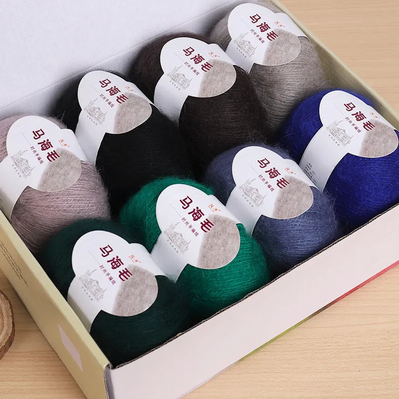 DIY mohair scarf knitting kit showing a ball of wool with 34 colour options including white, grey, pink, and blue.