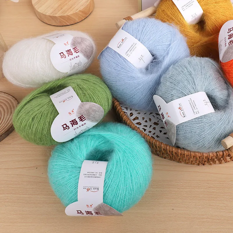 DIY mohair scarf knitting kit showing a ball of wool with 34 colour options including white, grey, pink, and blue.