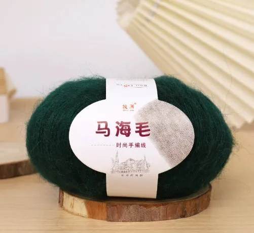 DIY mohair scarf knitting kit showing a ball of wool with 34 colour options including white, grey, pink, and blue.