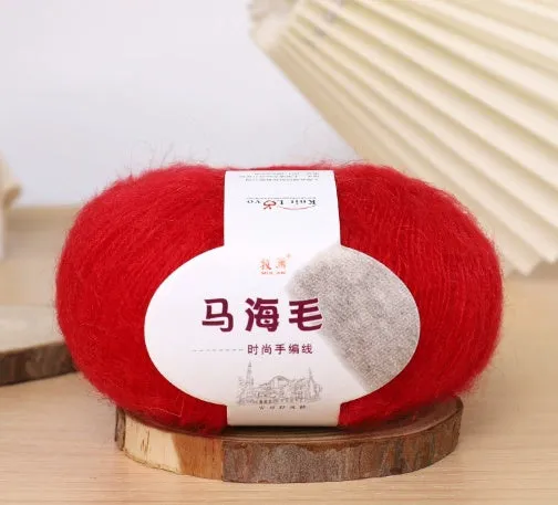 DIY mohair scarf knitting kit showing a ball of wool with 34 colour options including white, grey, pink, and blue.