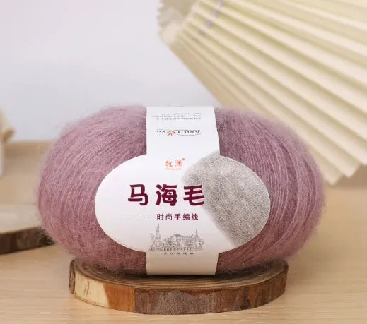 DIY mohair scarf knitting kit showing a ball of wool with 34 colour options including white, grey, pink, and blue.