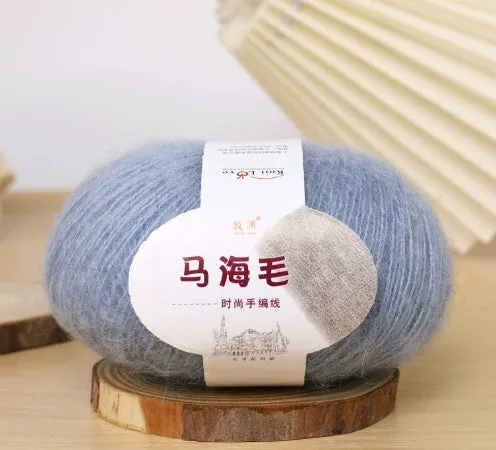 DIY mohair scarf knitting kit showing a ball of wool with 34 colour options including white, grey, pink, and blue.