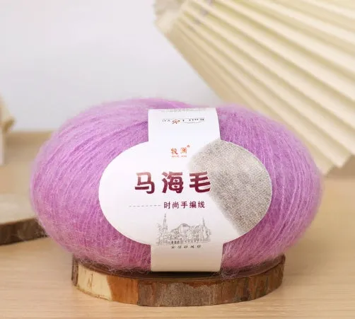 DIY mohair scarf knitting kit showing a ball of wool with 34 colour options including white, grey, pink, and blue.