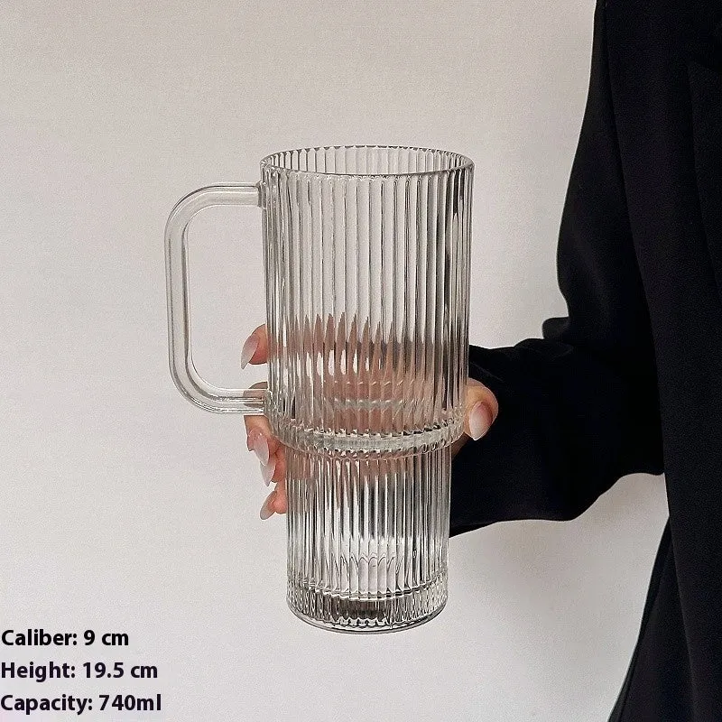 740ml hand-blown glass cup with handle, lid, and curved straw on a table
