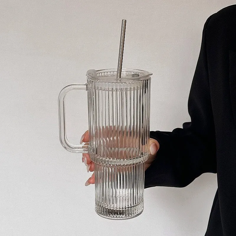 740ml hand-blown glass cup with handle, lid, and curved straw on a table