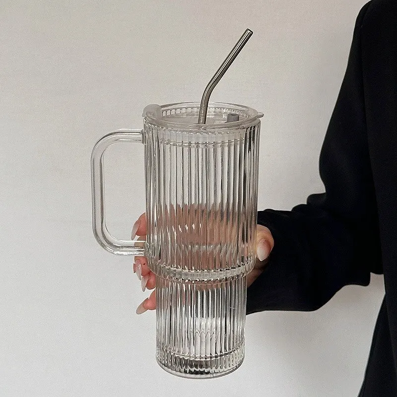 740ml hand-blown glass cup with handle, lid, and curved straw on a table