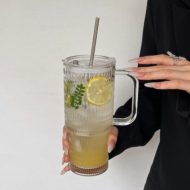740ml hand-blown glass cup with handle, lid, and curved straw on a table