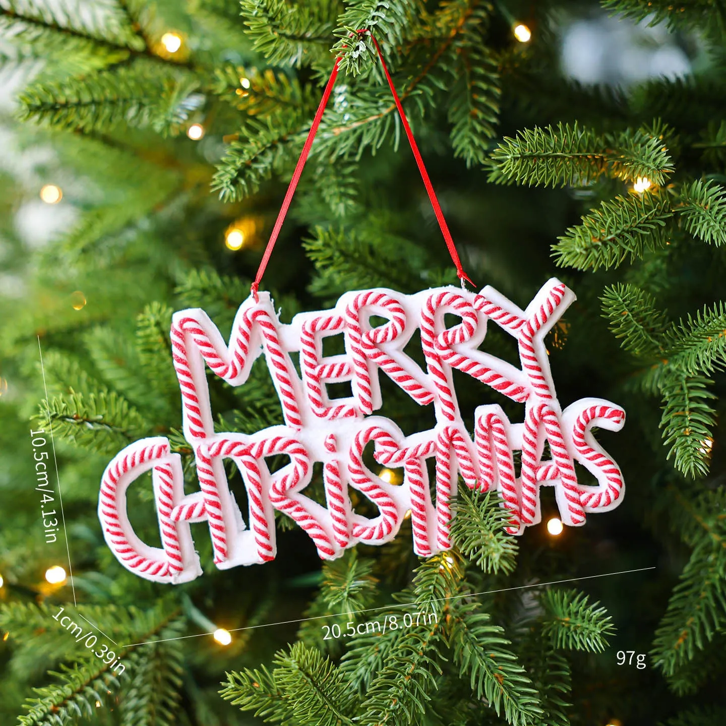 Merry Christmas letter plate polymer clay ornament in red and white hanging on Christmas tree branch