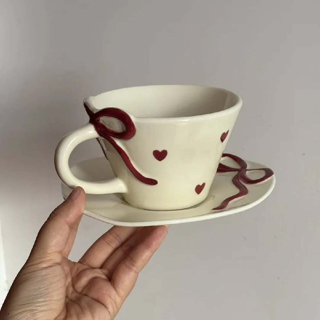Hand painted ceramic coffee cup and saucer set in Cherry colour, irregular shape, white porcelain, 301-400ml capacity