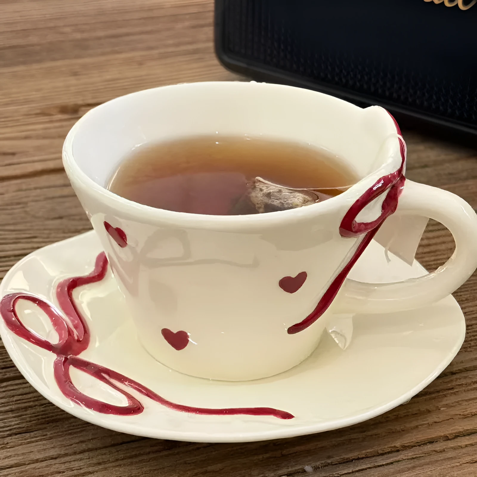 Hand painted ceramic coffee cup and saucer set in Cherry colour, irregular shape, white porcelain, 301-400ml capacity