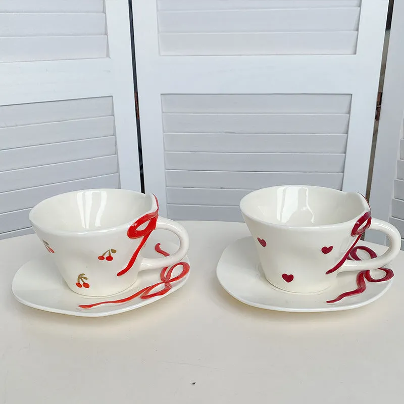 Hand painted ceramic coffee cup and saucer set in Cherry colour, irregular shape, white porcelain, 301-400ml capacity