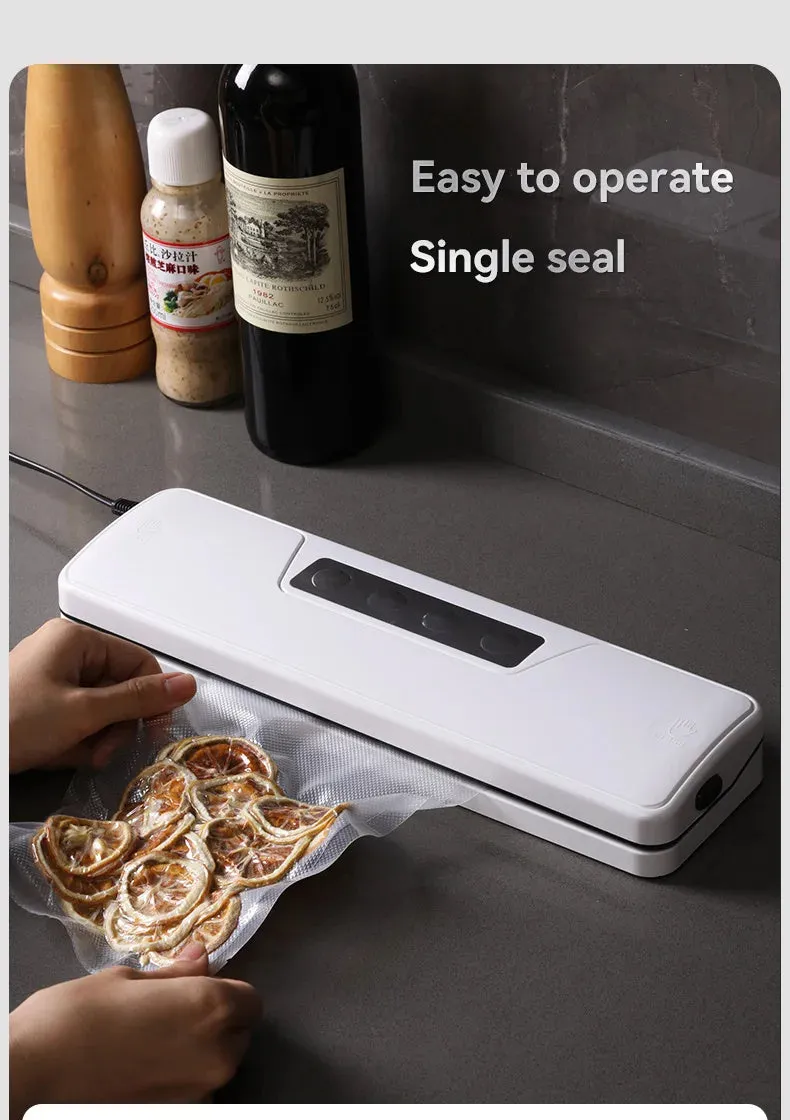 White automatic vacuum sealer machine on a kitchen counter
