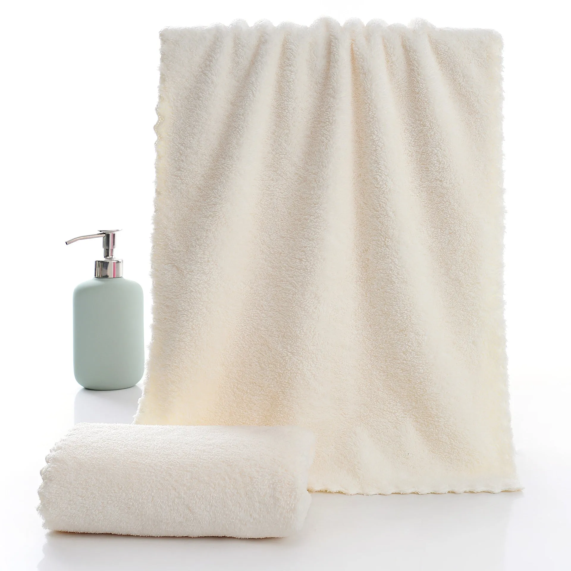 Coral fleece absorbent household towel in coral pink colour showing soft textured surface