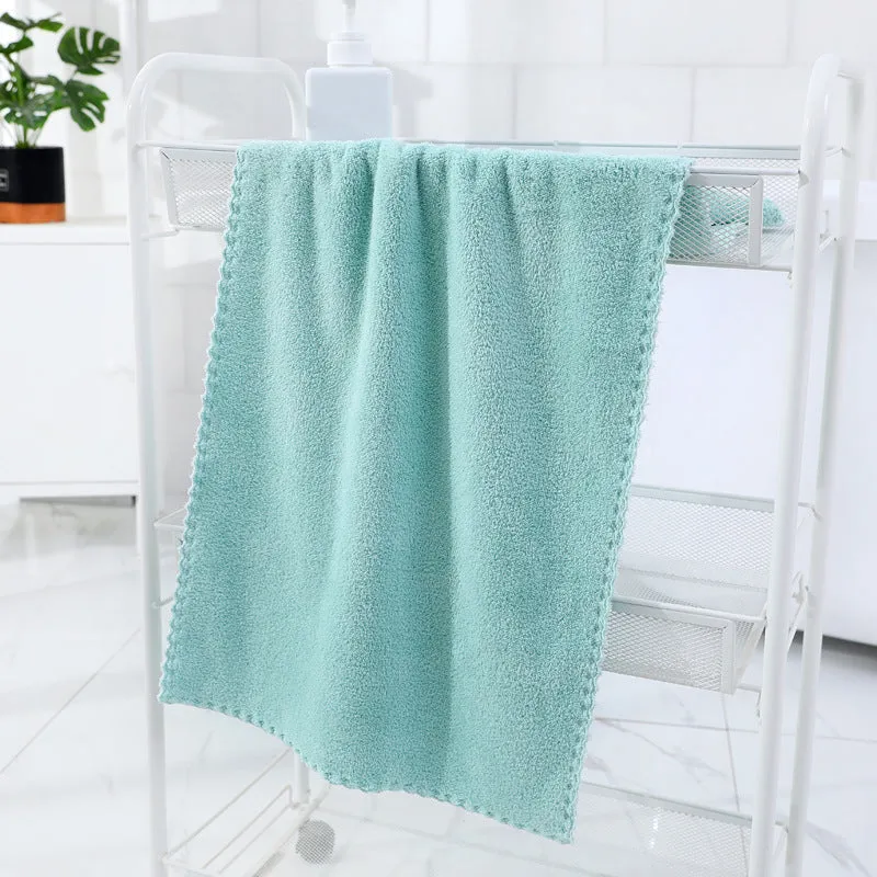 Coral fleece absorbent household towel in coral pink colour showing soft textured surface