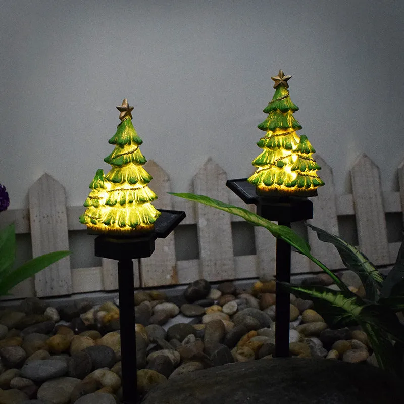 Solar Christmas tree ground plug light with warm white LED on a lawn, IP65 waterproof resin construction