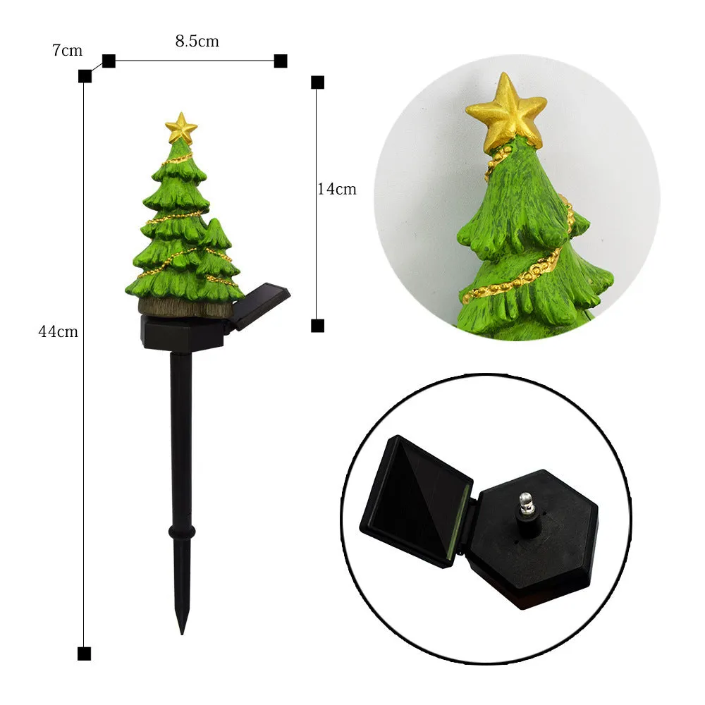 Solar Christmas tree ground plug light with warm white LED on a lawn, IP65 waterproof resin construction