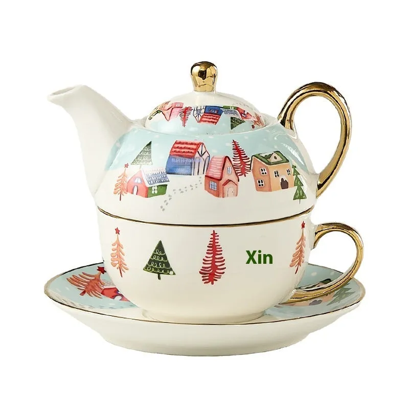 Ceramic tea set with gold-plated teapot and matching cup on dish, snowflake pattern, gift box