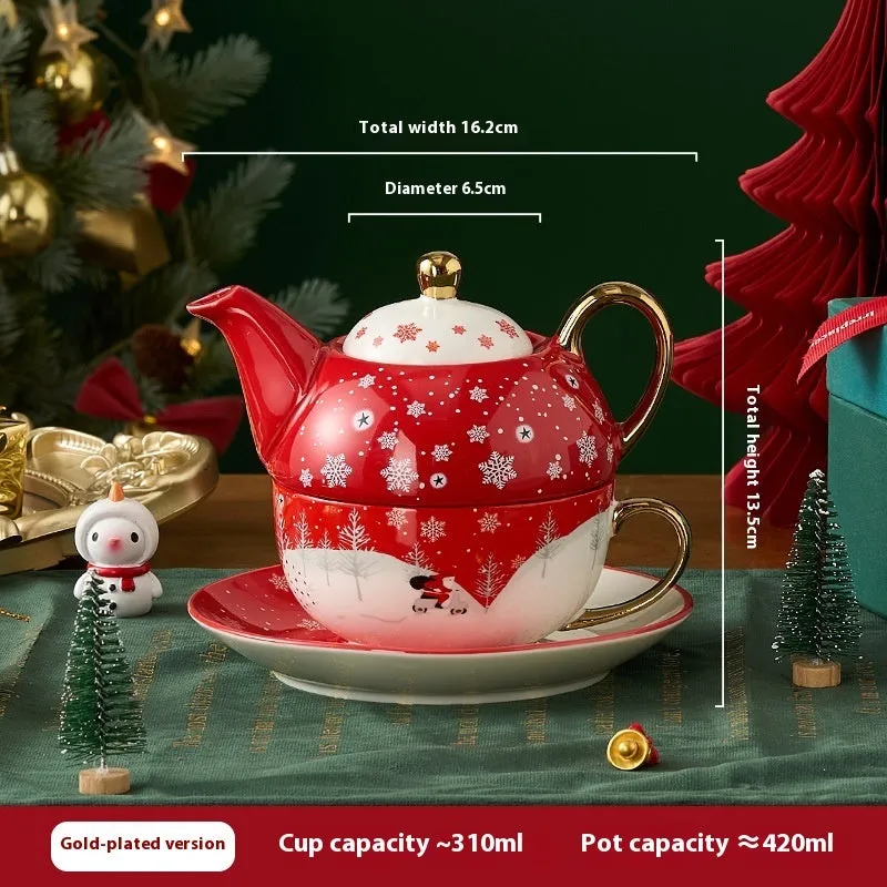 Ceramic tea set with gold-plated teapot and matching cup on dish, snowflake pattern, gift box
