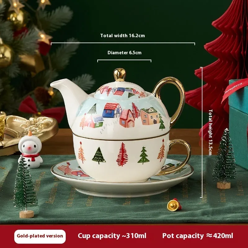 Ceramic tea set with gold-plated teapot and matching cup on dish, snowflake pattern, gift box