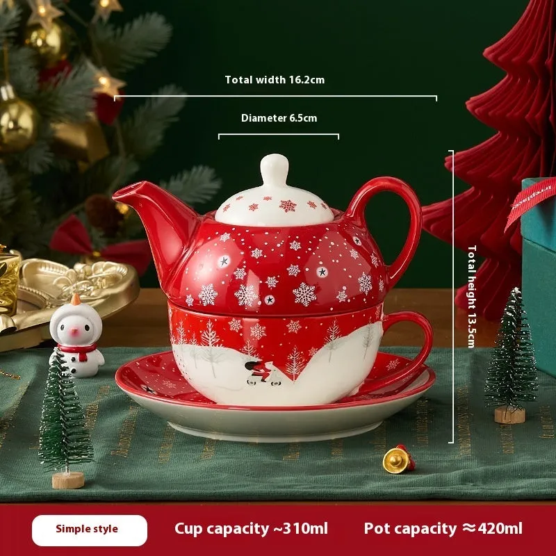 Ceramic tea set with gold-plated teapot and matching cup on dish, snowflake pattern, gift box