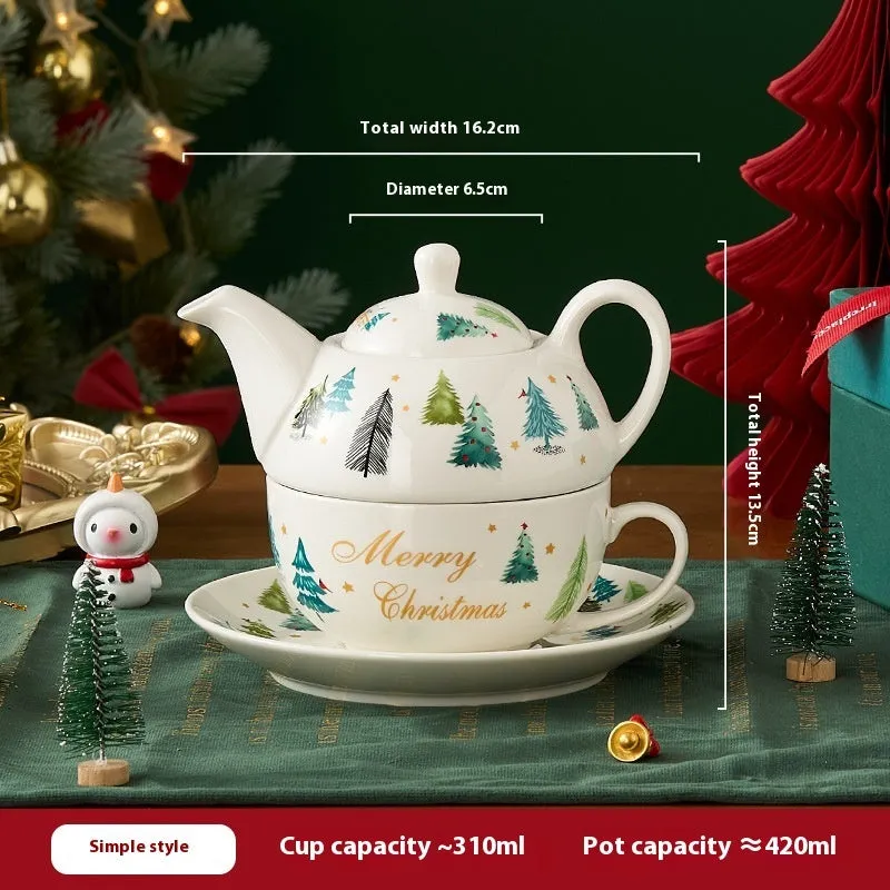 Ceramic tea set with gold-plated teapot and matching cup on dish, snowflake pattern, gift box