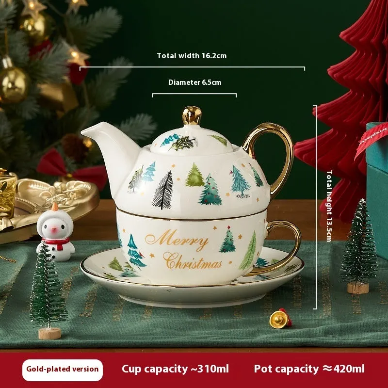 Ceramic tea set with gold-plated teapot and matching cup on dish, snowflake pattern, gift box