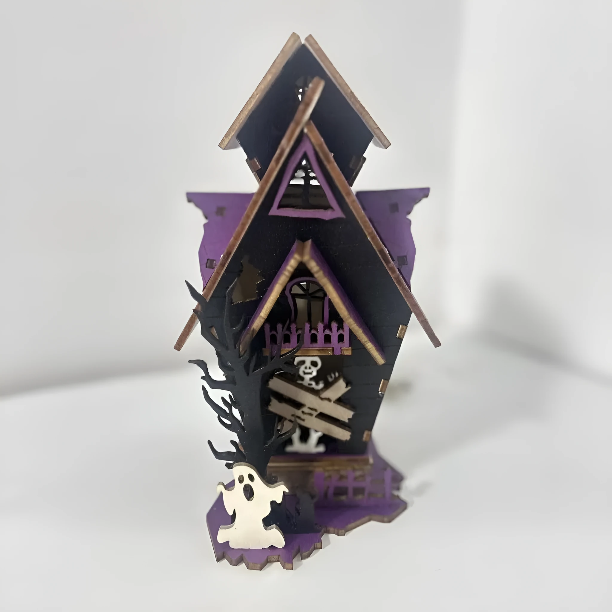 DIY wooden glowing haunted house Halloween table decoration and candlestick holder.