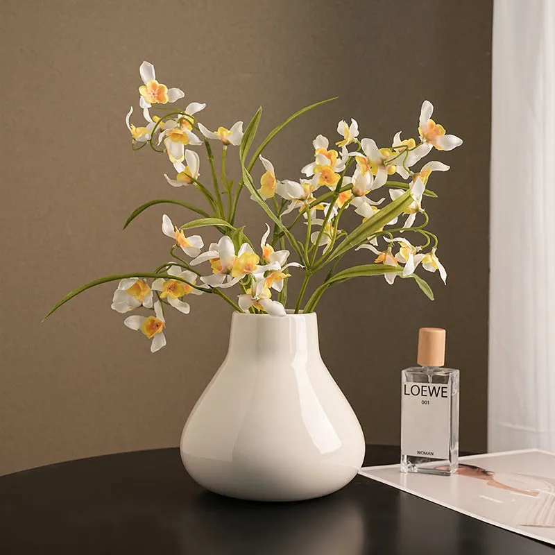 Ceramic round belly vase with black or white coloured glaze finish and modern simplicity design
