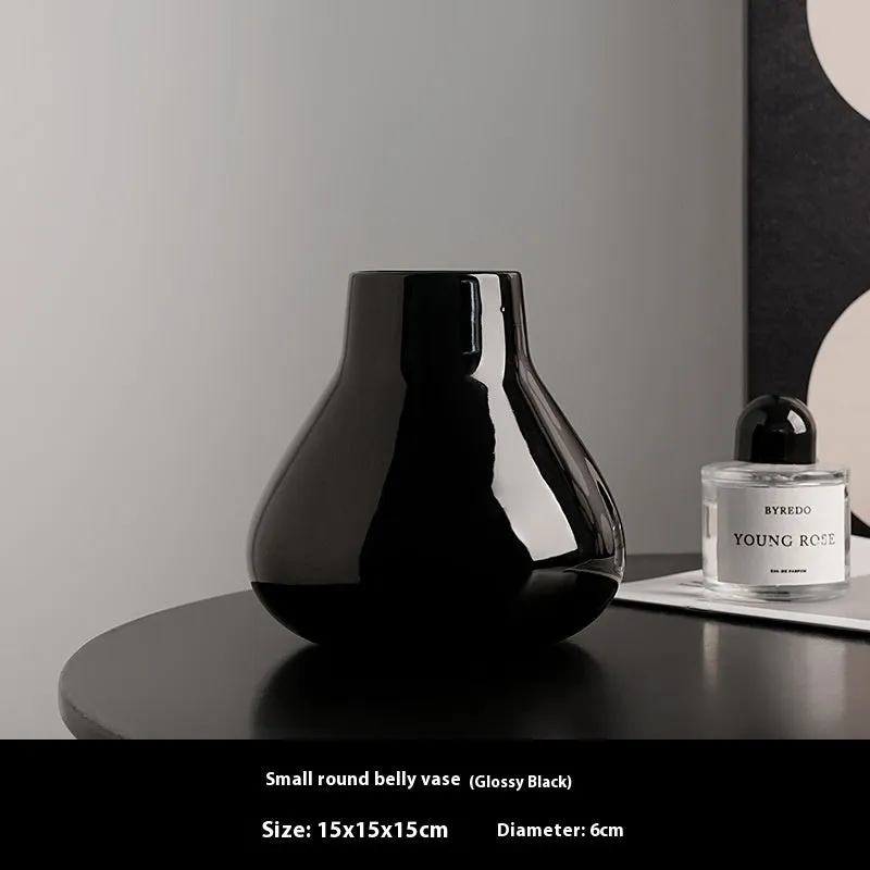 Ceramic round belly vase with black or white coloured glaze finish and modern simplicity design