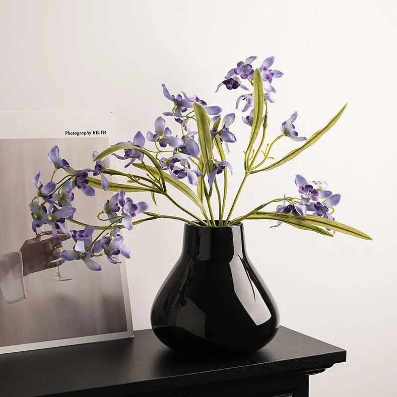 Ceramic round belly vase with black or white coloured glaze finish and modern simplicity design