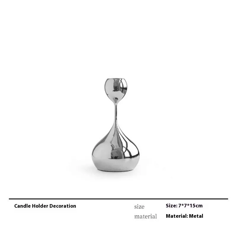 Modern wine accessories set including glassware, ice bucket, and stainless steel ornaments on a table