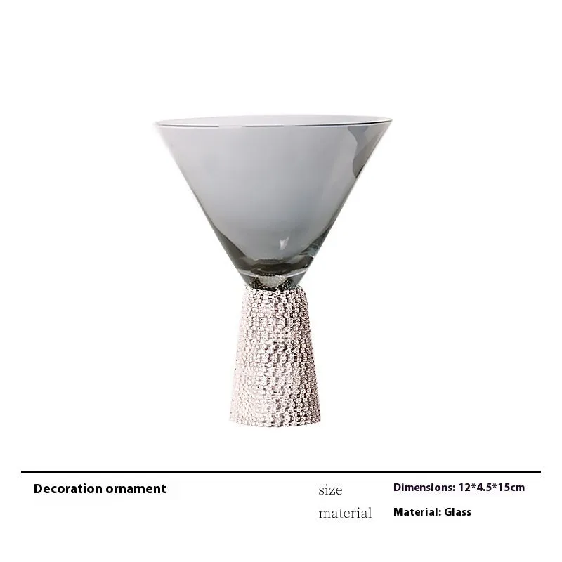 Modern wine accessories set including glassware, ice bucket, and stainless steel ornaments on a table