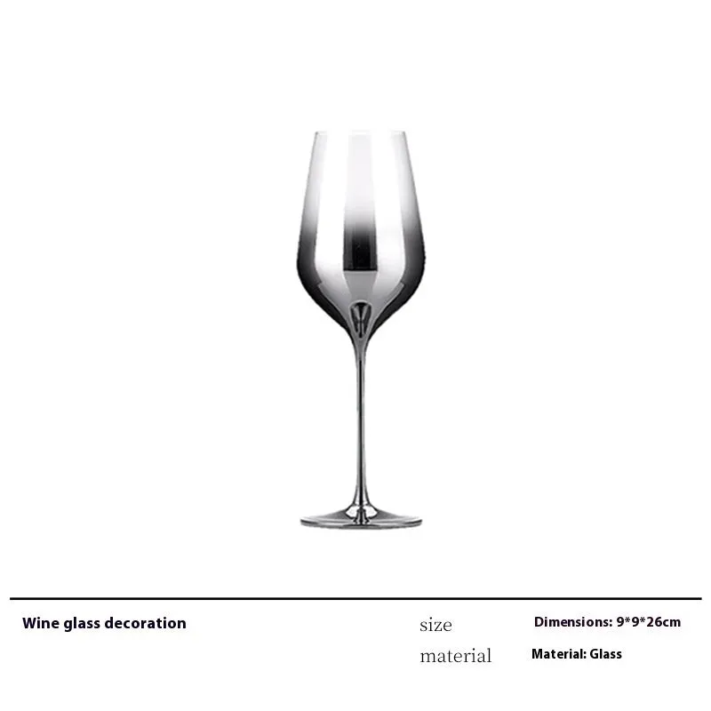 Modern wine accessories set including glassware, ice bucket, and stainless steel ornaments on a table