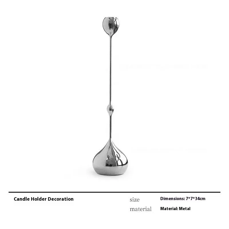 Modern wine accessories set including glassware, ice bucket, and stainless steel ornaments on a table