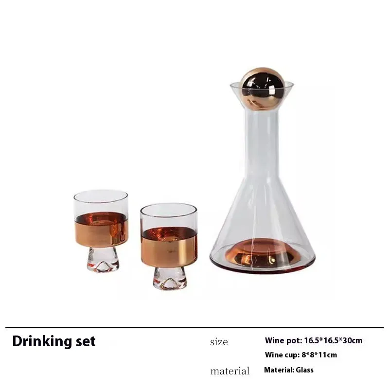 Modern wine accessories set including glassware, ice bucket, and stainless steel ornaments on a table