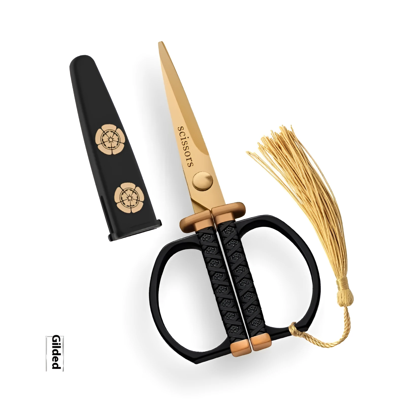 Gold, black, and silver art paper cutting scissors with straight head blades on a white background