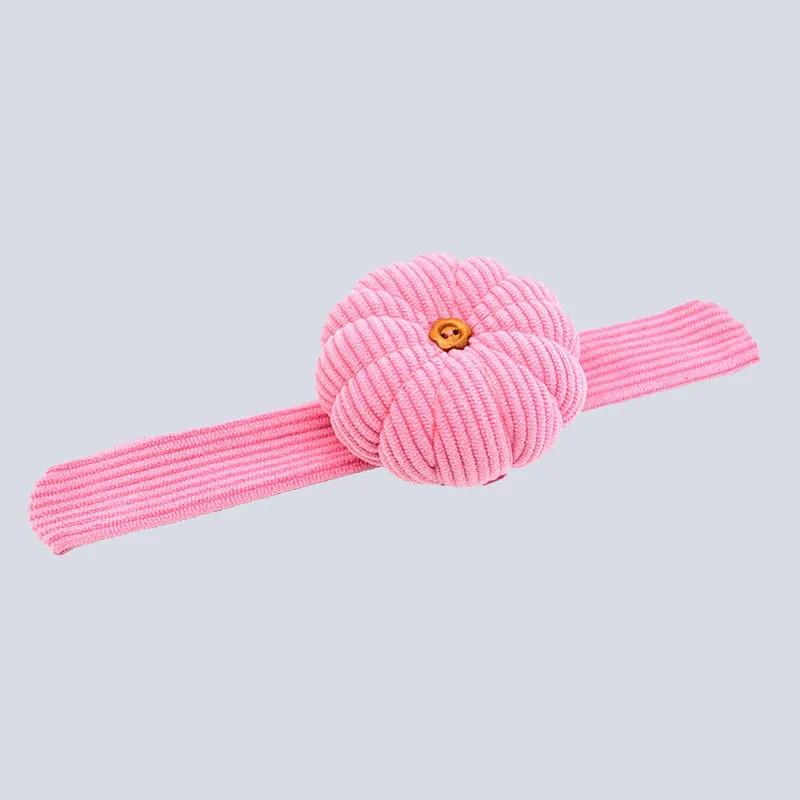 Ring pincushion sewing tool with vertical cutting slot in caramel colour showing fabric cushion and metal ring base