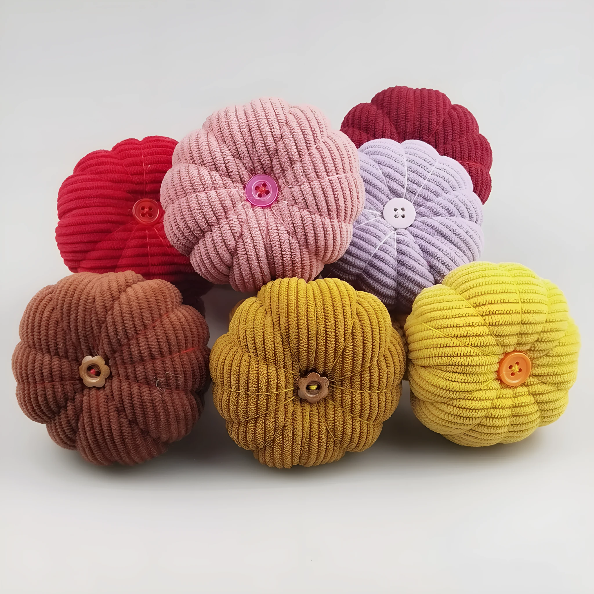 Ring pincushion sewing tool with vertical cutting slot in caramel colour showing fabric cushion and metal ring base