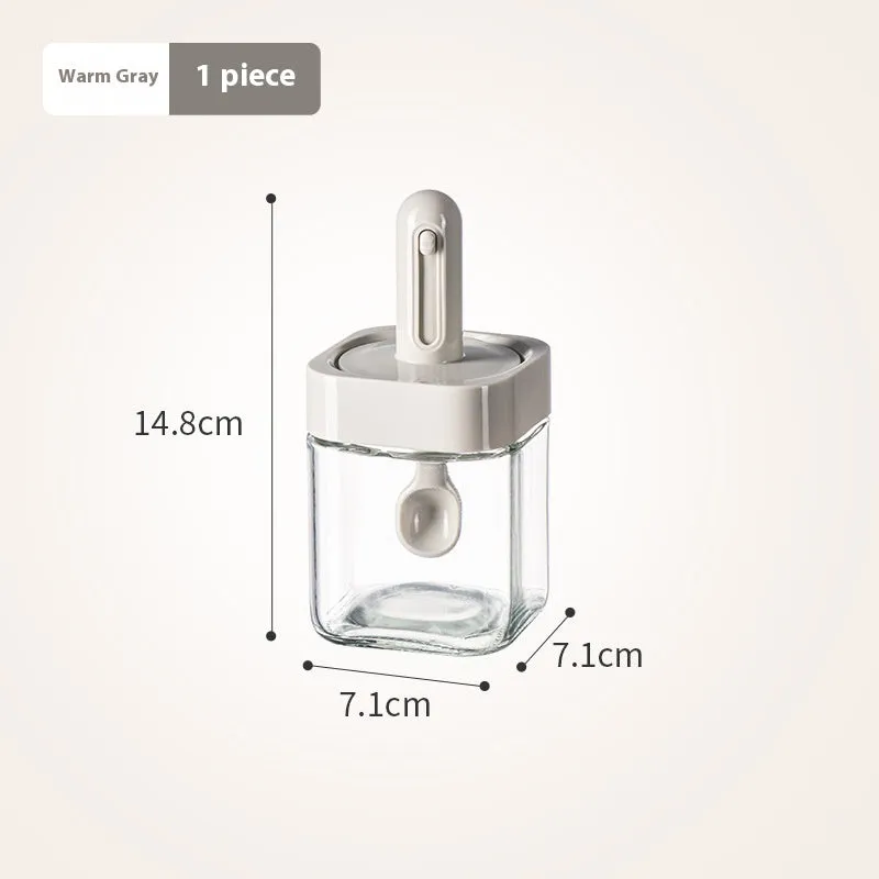 Yellow retractable glass seasoning jar with lid in Nordic style on kitchen counter