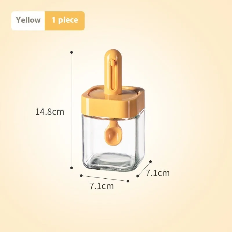 Yellow retractable glass seasoning jar with lid in Nordic style on kitchen counter