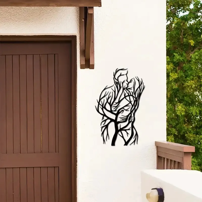 Black iron wall decoration with couple hug silhouette in modern simplicity style