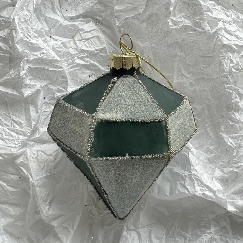 Handmade glass Christmas bauble 8cm diameter in green on branch