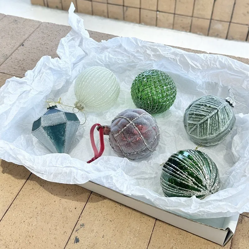 Handmade glass Christmas bauble 8cm diameter in green on branch