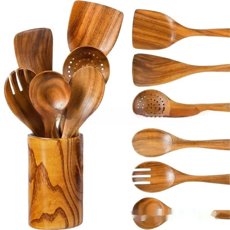 Seven-piece wooden kitchen utensil set including various spoons and spatulas on a table.