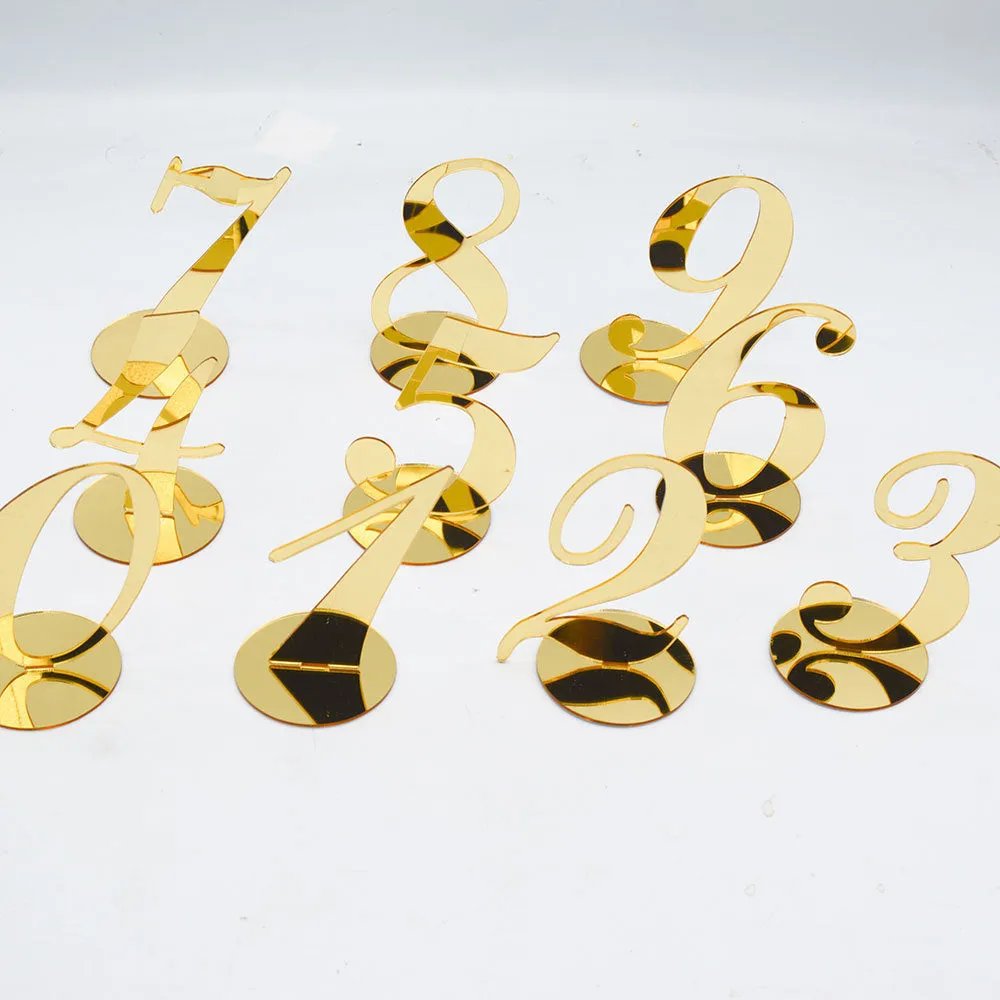 Clear acrylic table number holder with gold base displaying number 1 on a table