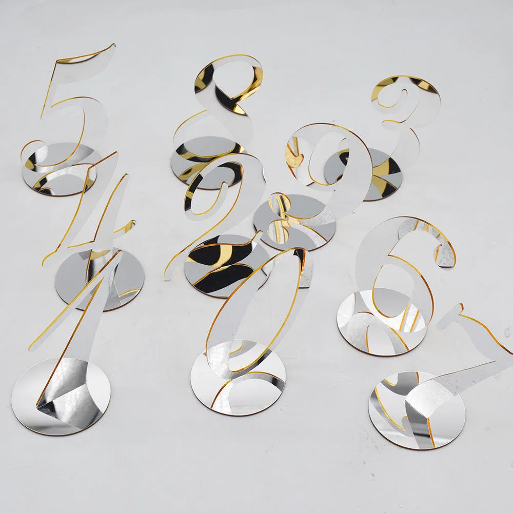 Clear acrylic table number holder with gold base displaying number 1 on a table