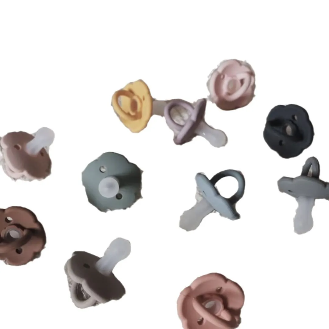 Baby pacifier in edible silicone with lace nipple in apricot colour for 0-6 months