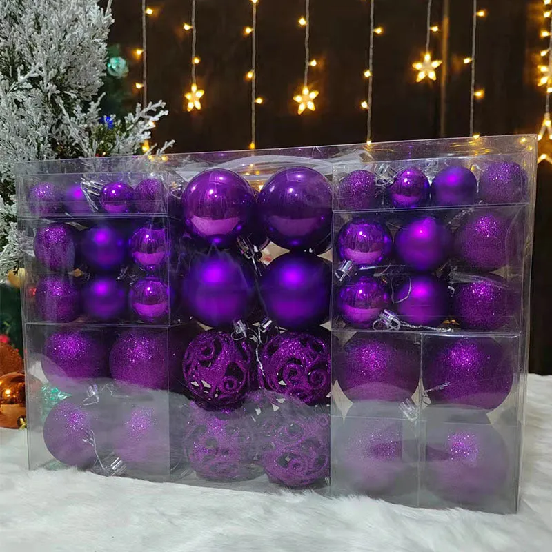 Boxed set of 100 colourful PVC Christmas tree balls in 3-6cm sizes on a neutral background